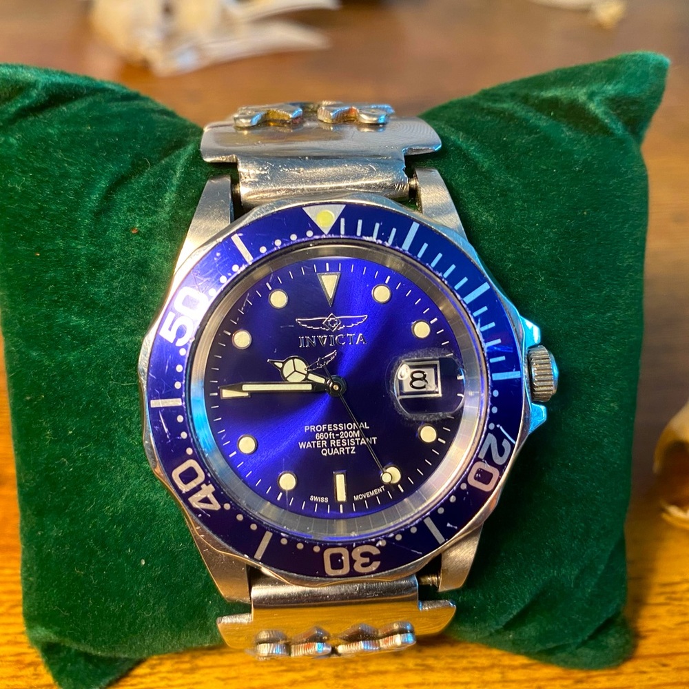 Blue invicta divers watch with steel cuffs